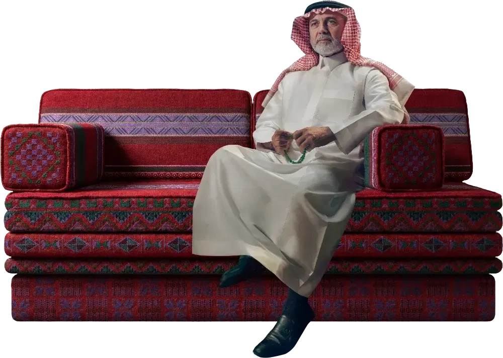 A Saudi man seated on a traditional majlis